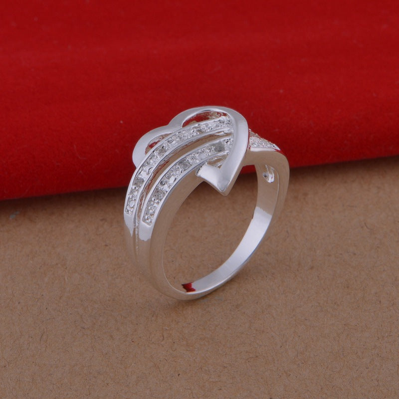 Woman's Sparkling Wishbone Heart Ring